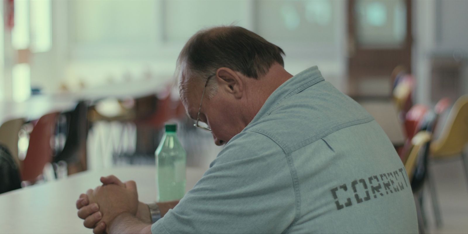man in a prison cafeteria in The Innocent Man documentary series.