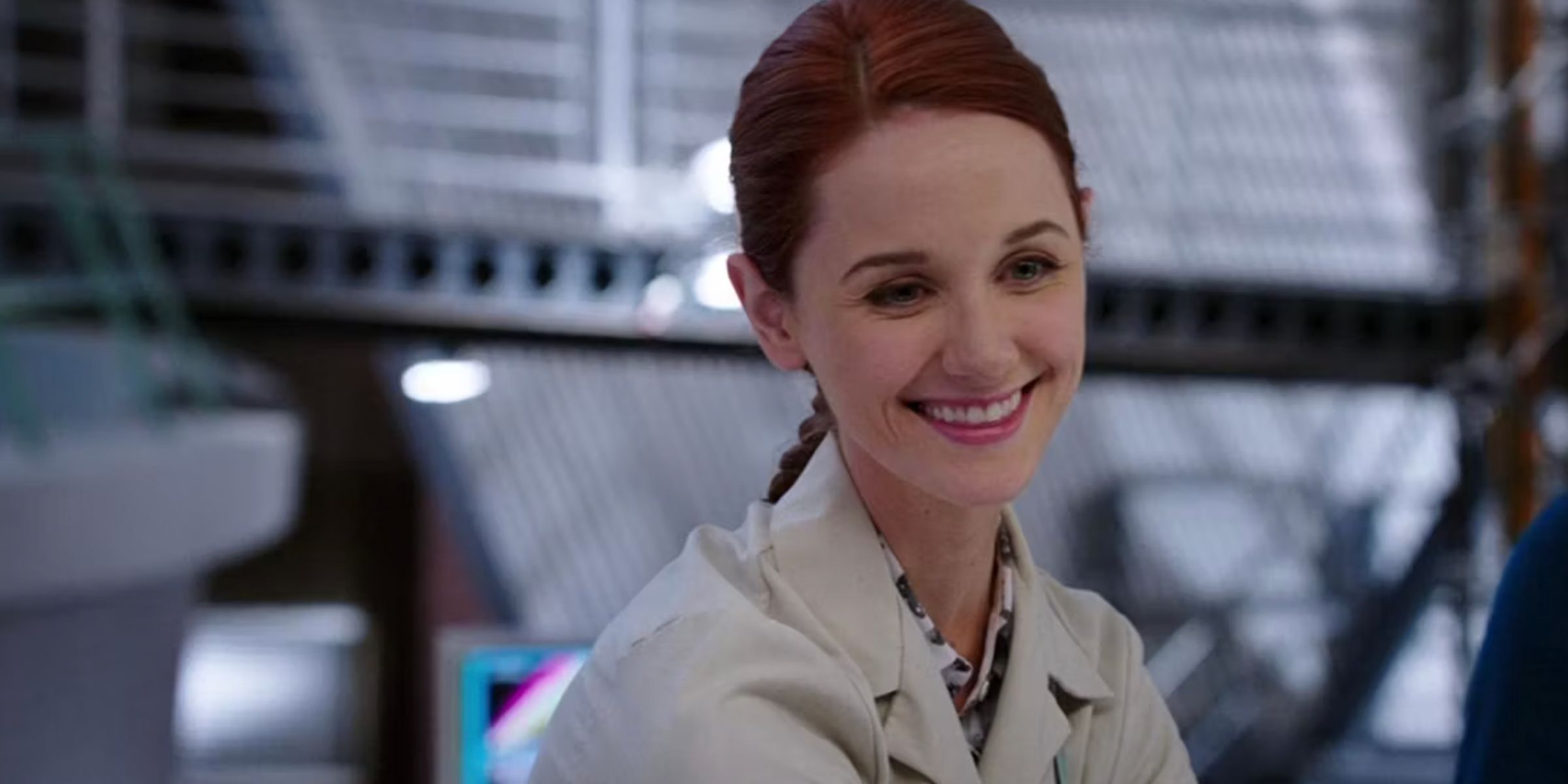 Jessica Warren smiles while working in the lab in Bones