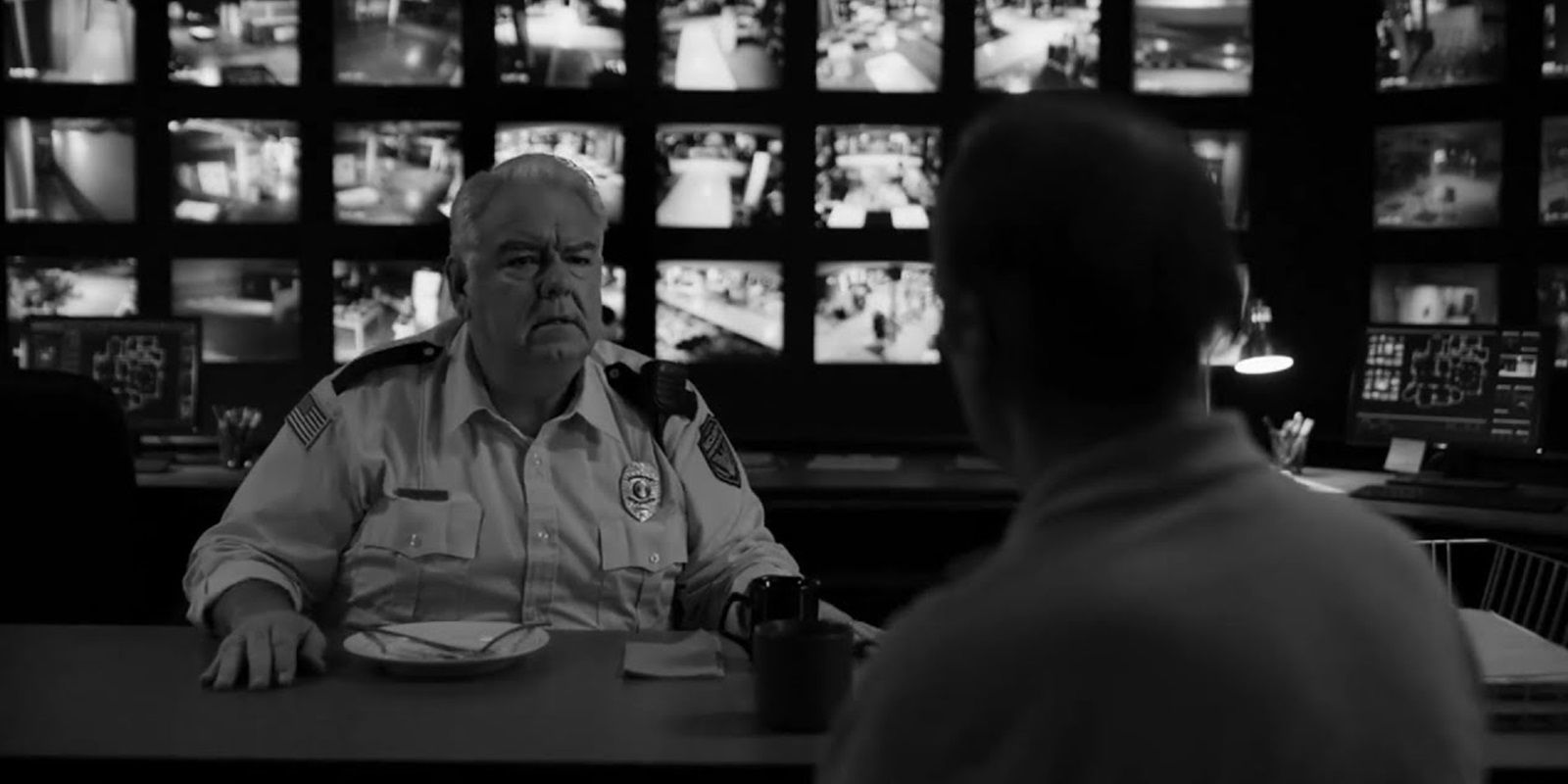 Jimmy sits with the mall security guard in Better Call Saul