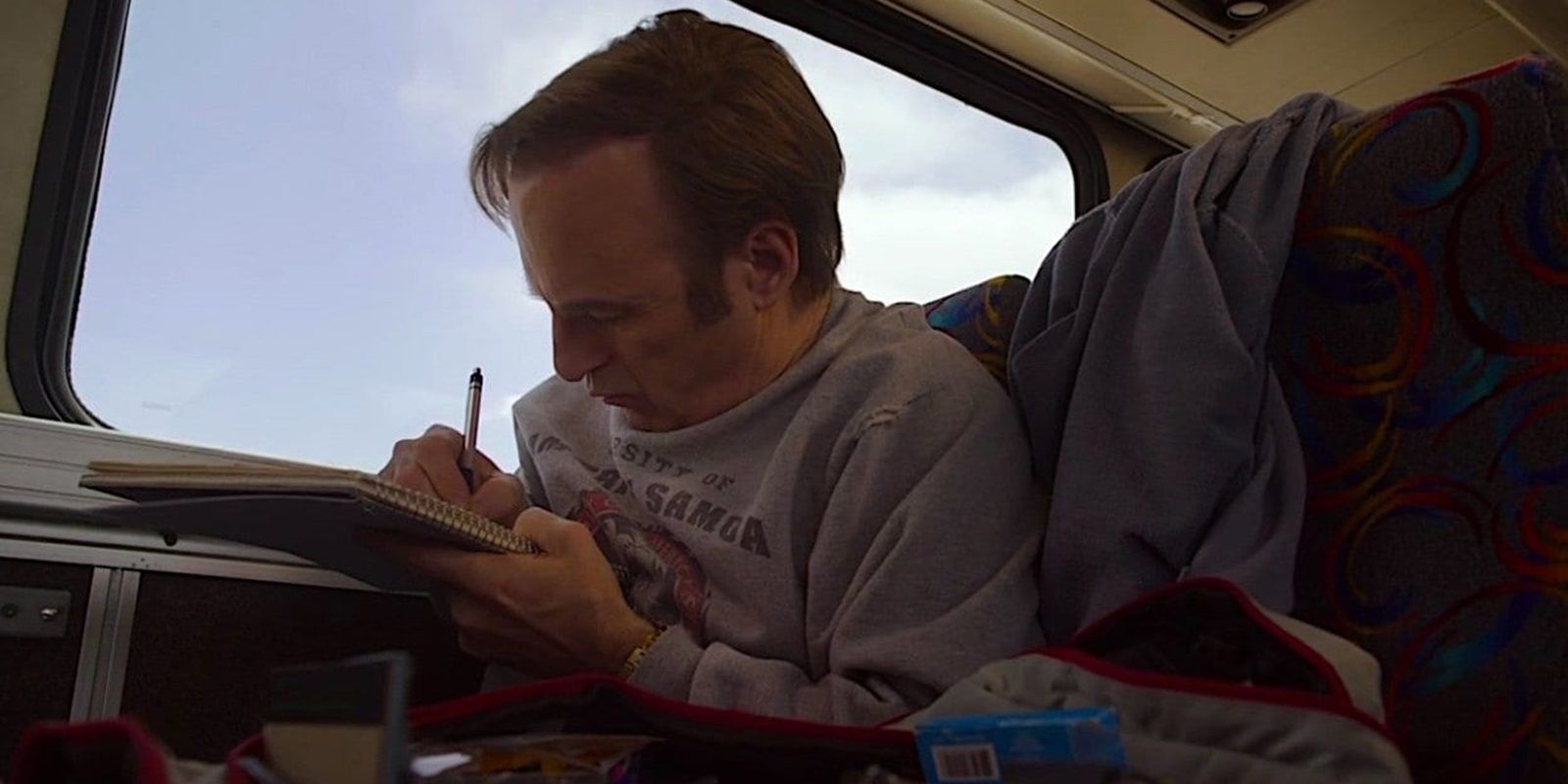 Jimmy writes letters on a bus in Better Call Saul