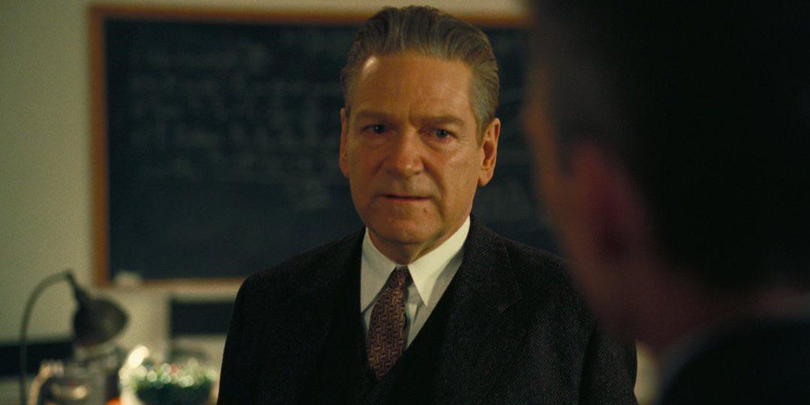 Kenneth Branagh looking serious in Oppenheimer