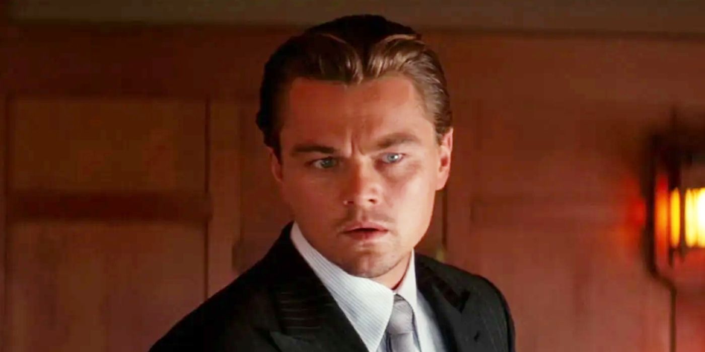 Leonardo DiCaprio as Dom Cobb looking at something off-screen in Inception's ending