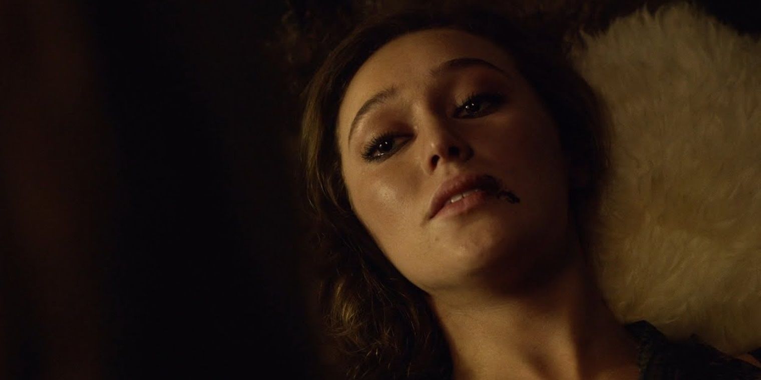 Alycia Debnam-Carey as Lexa's lying in bed and dying in The 100