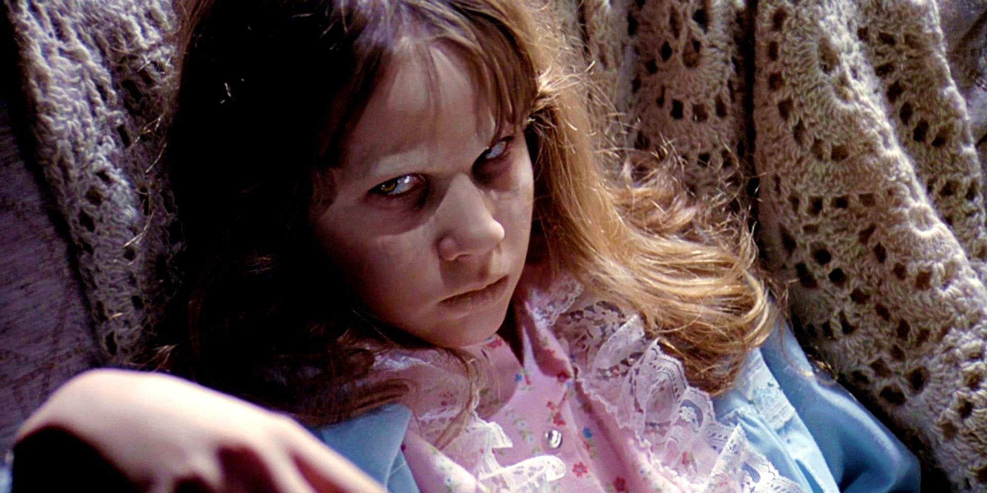 Linda Blair as the possessed child with a creepy stare in The Exorcist