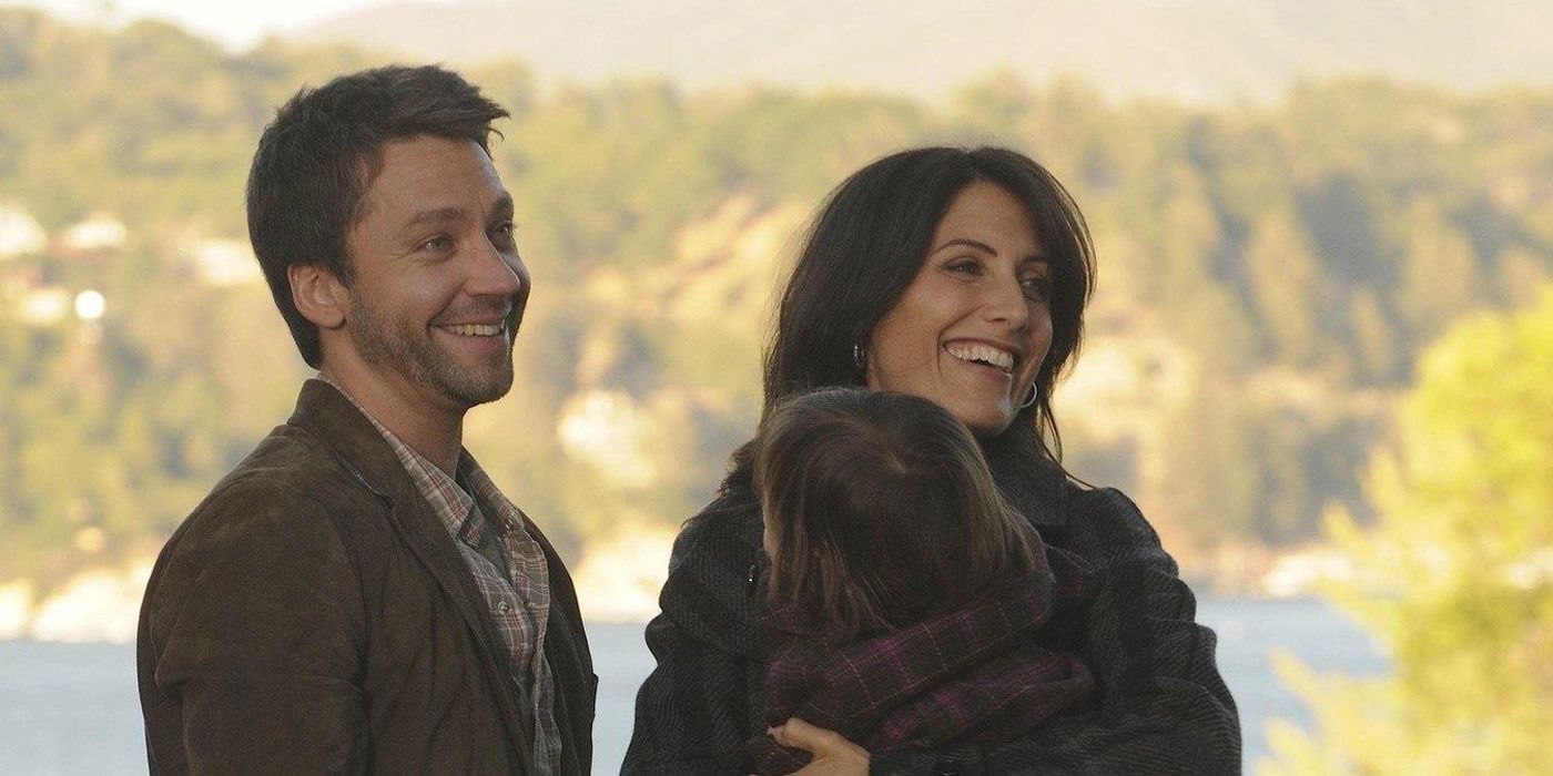 Lucas and Lisa Cuddy Smiling with a Child in House, M.D.