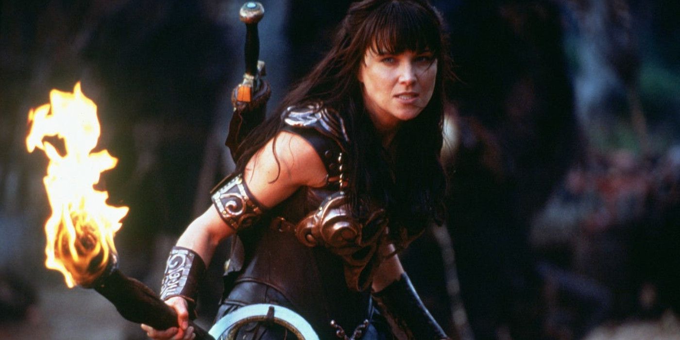 Lucy Lawless as Xena Warrior Princess holding a torch with fire