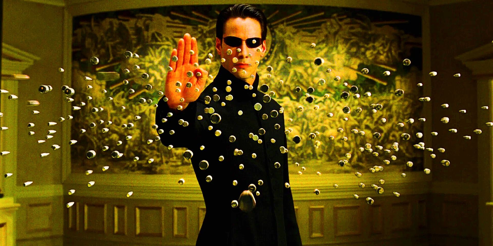 Neo with his hand up in The Matrix