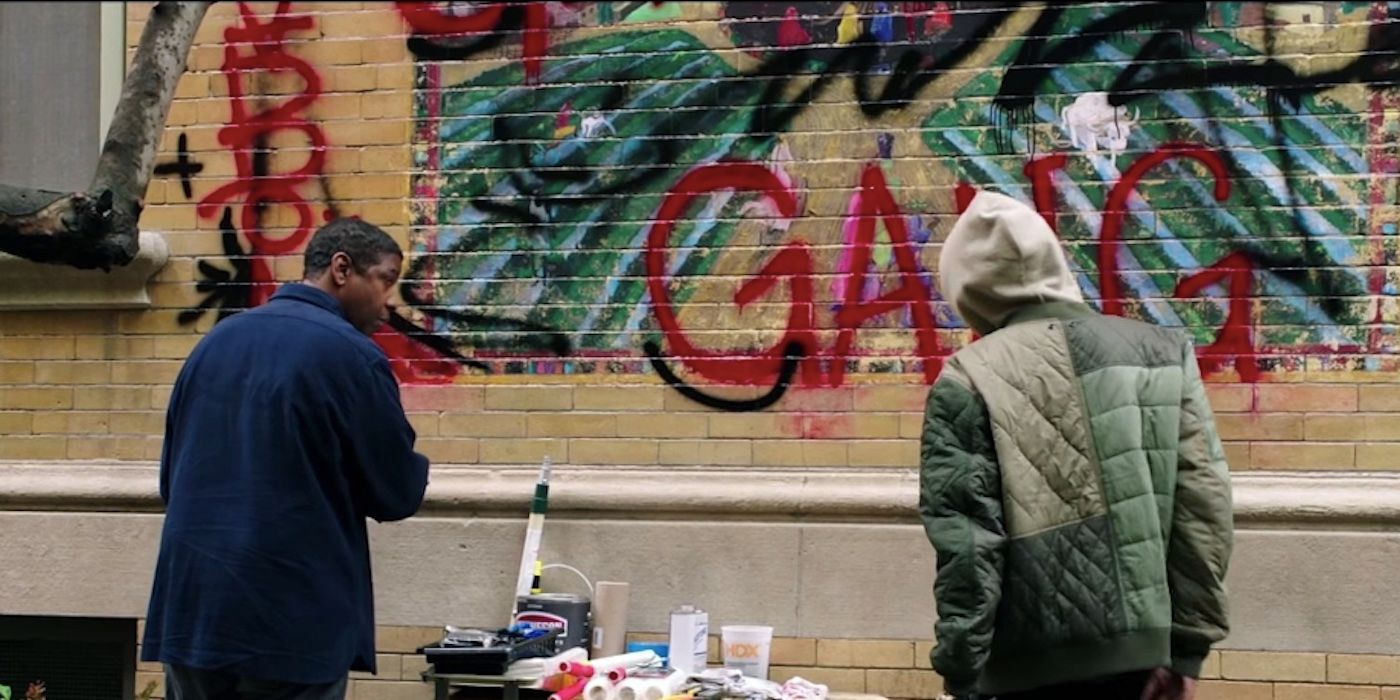 Miles and Robert stand by the mural site in The Equalizer 2