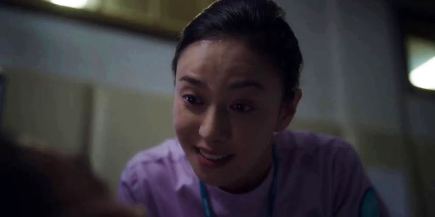 Nurse Park looks down at a patient with a sinister expression in It&rsquo;s Okay to Not Be Okay.