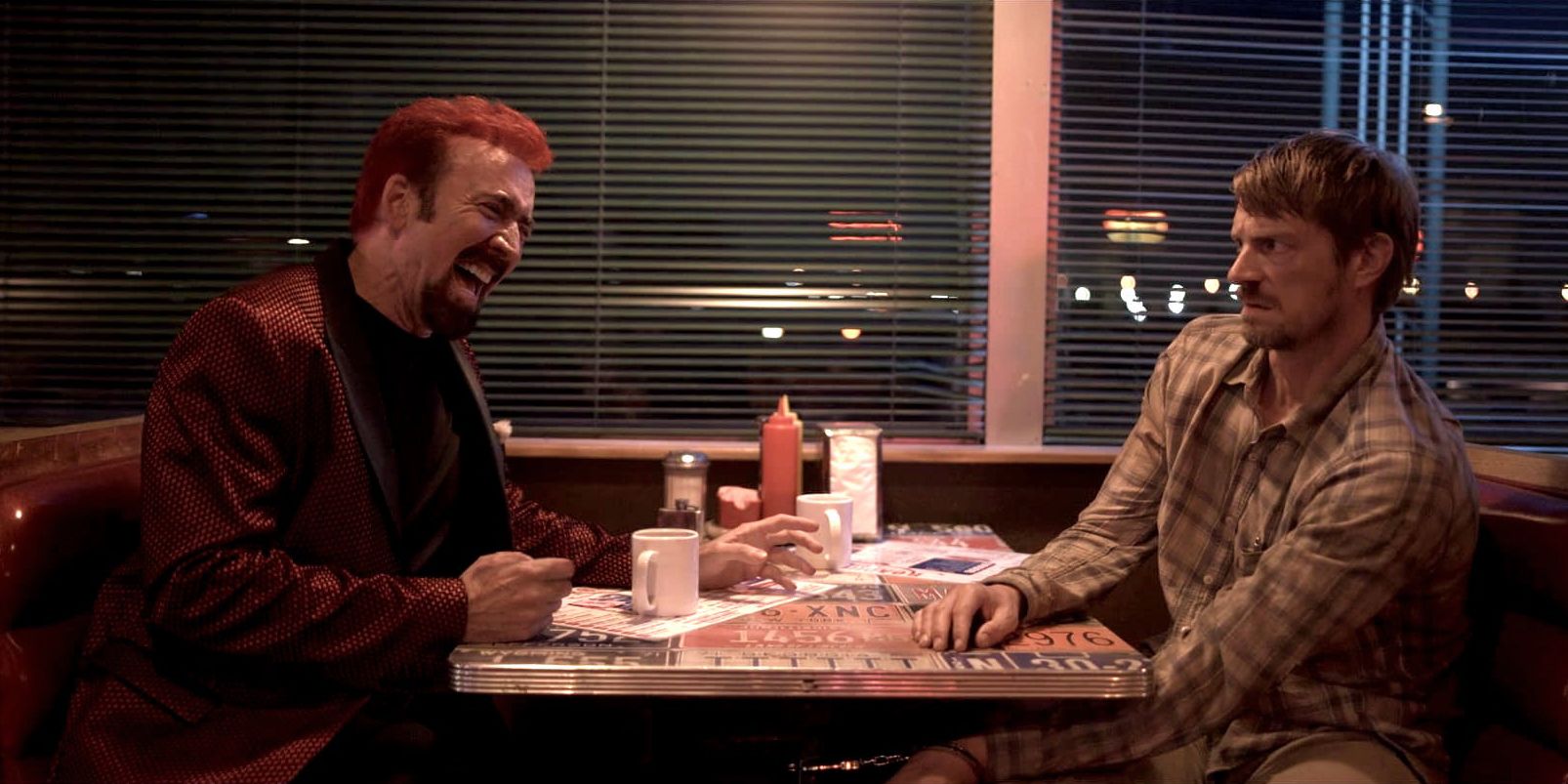 Nicolas Cage and Joel Kinnaman in a diner in Sympathy for the Devil