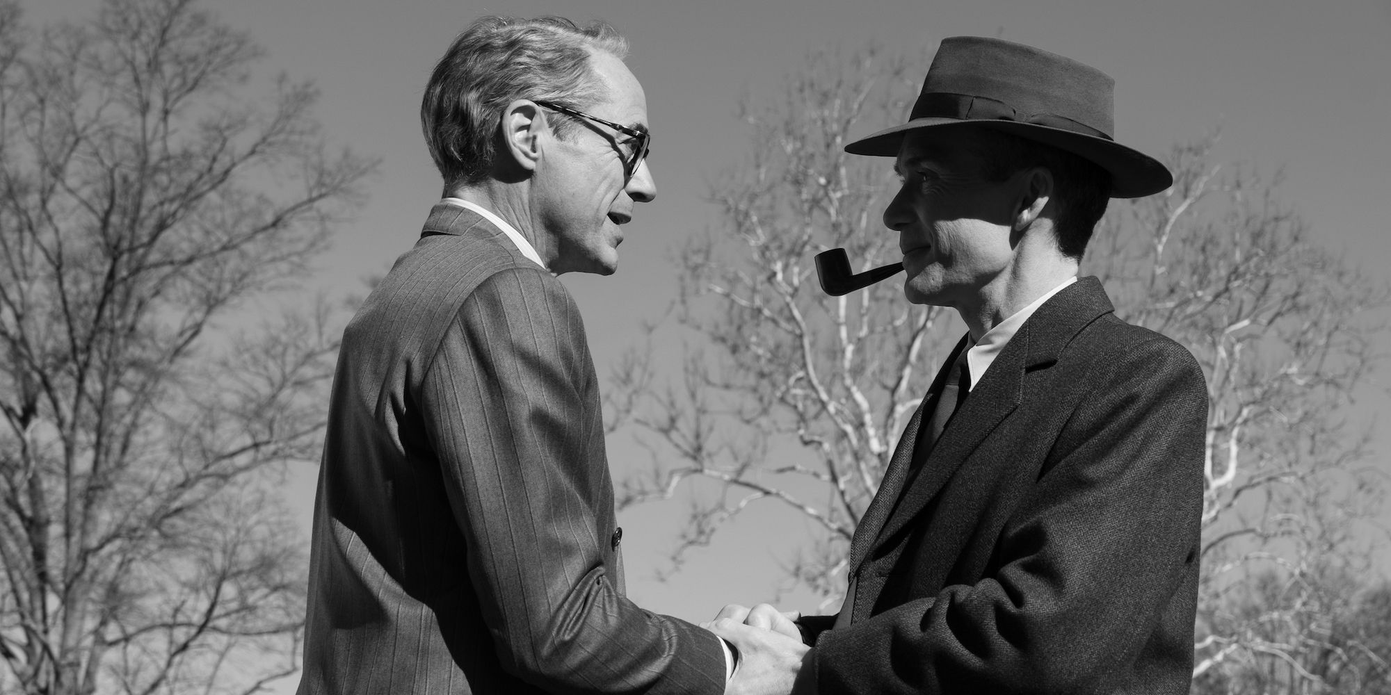 A black and white image of Oppenheimer meeting Strauss in the biopic movie