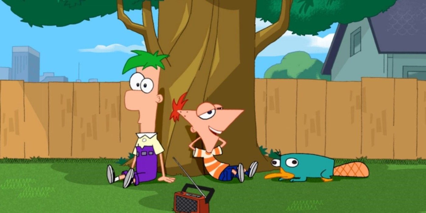 Phineas and Ferb and Perry the platypus sitting under a tree in their backyard.