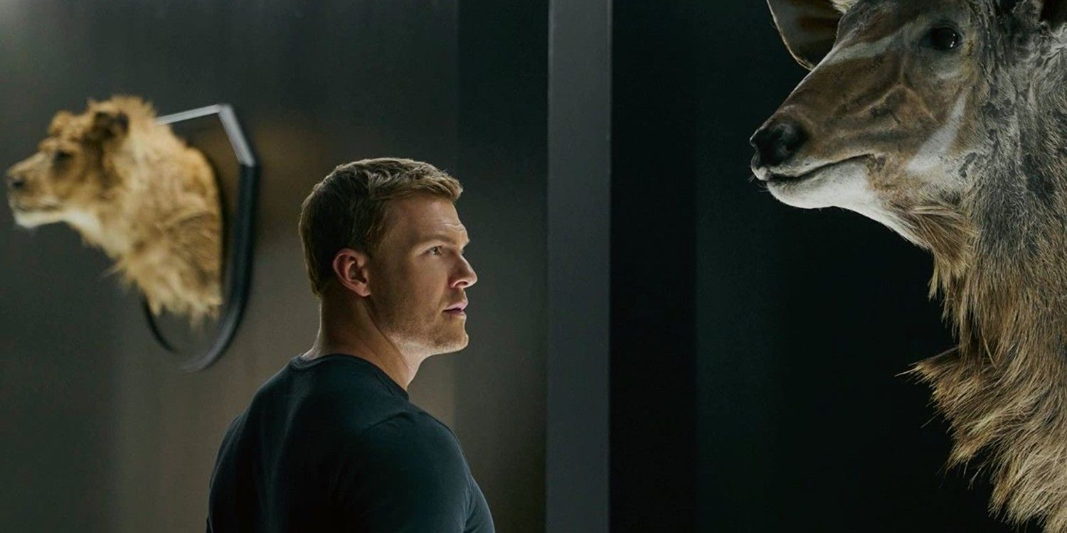 Jack looks at animals' heads on the wall in Reacher