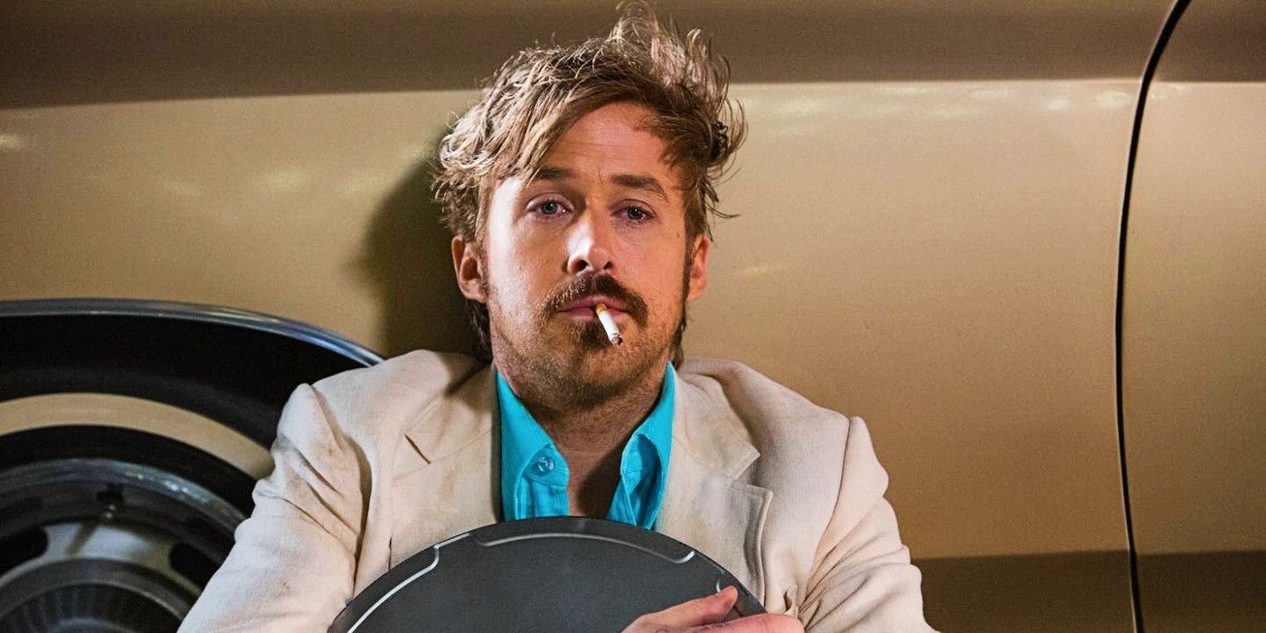 Ryan Gosling in The Nice Guys, holding a cigarette in his mouth and clutching a roll of film.