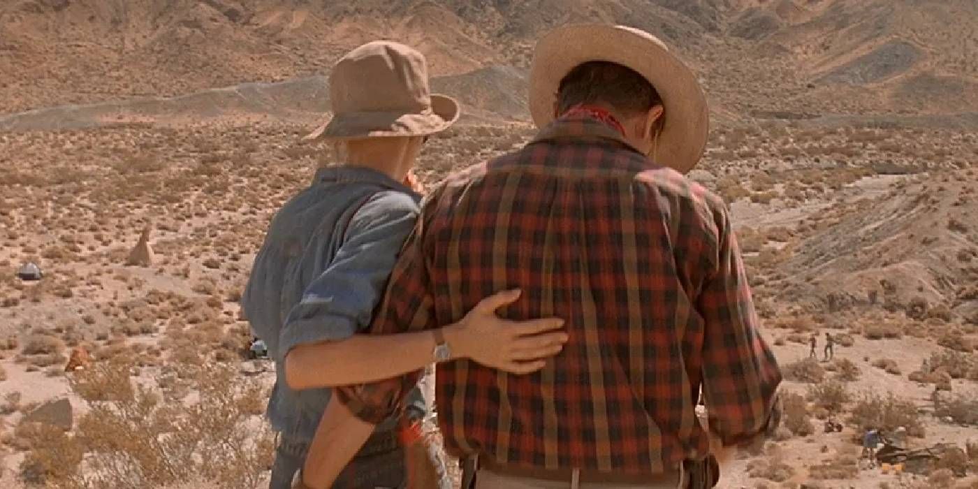 Sam Neill and Laura Dern walking together in Jurassic Park