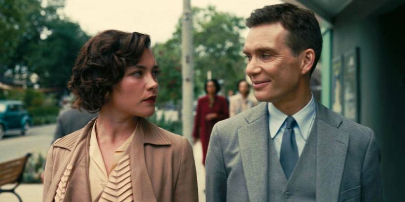 Florence Pugh and Cillian Murphy as Jean Tatlock and J. Robert Oppenheimer walking down the street