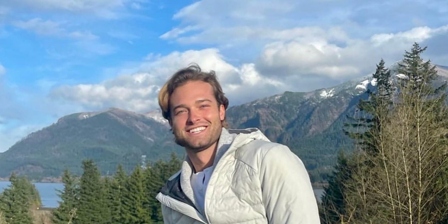 Sean McLaughlin from The Bachelorette season 20 smiling in front of mountains