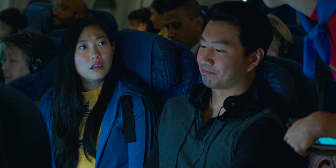 Shang-Chi and Katy on plane in Shang-Chi and the Legend of the Ten Rings