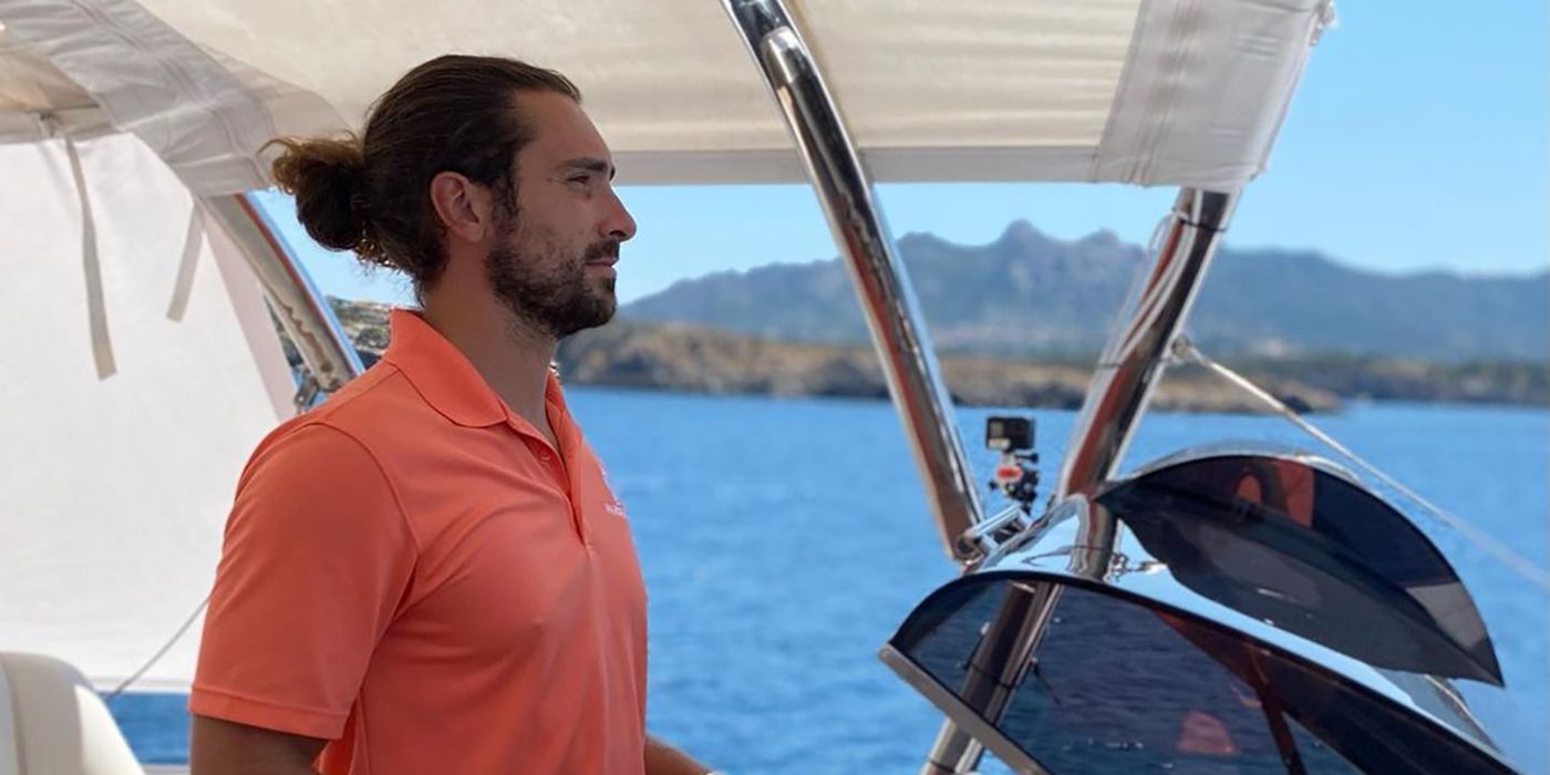 Alex Propson on Below Deck Sailing Yacht looking out at the water