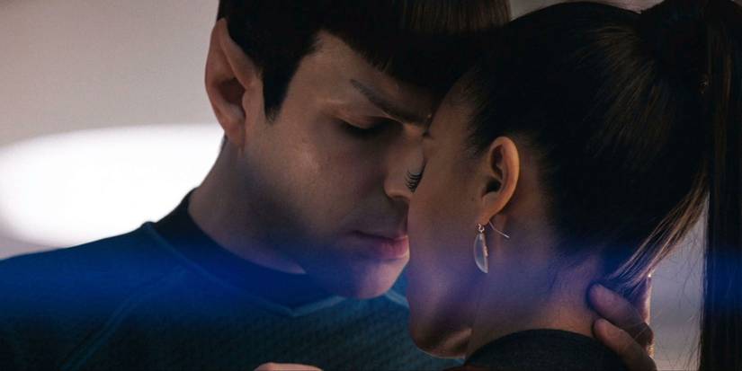 Zachary Quinto as Spock with his head against Zoe Saldana's Uhura in Star Trek