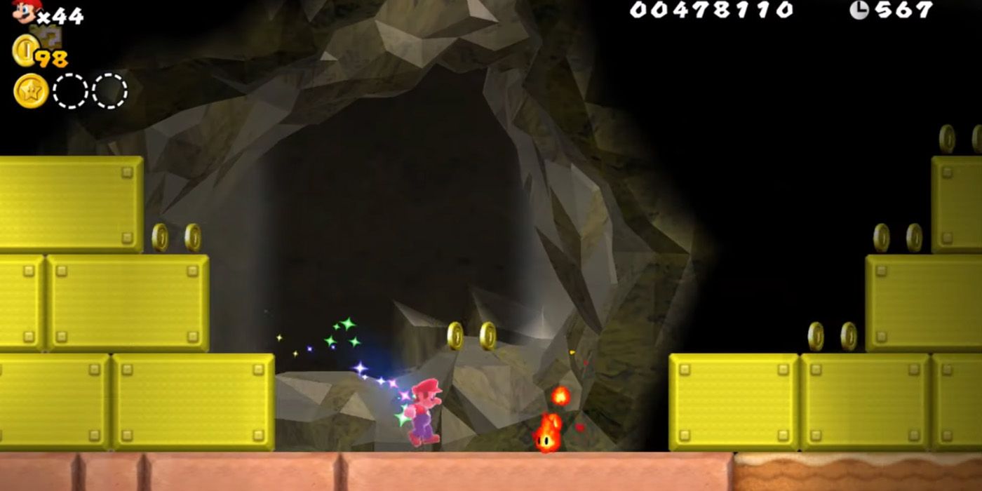 Mario with a Super Star Powerup about to run into a flame enemy in New Super Mario Bros. Wii.