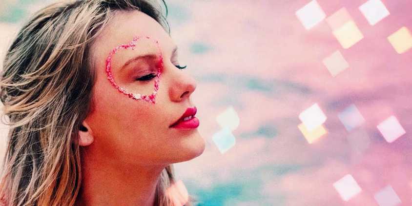 Taylor Swift with a heart painted over her eye in her music video for Cruel Summer