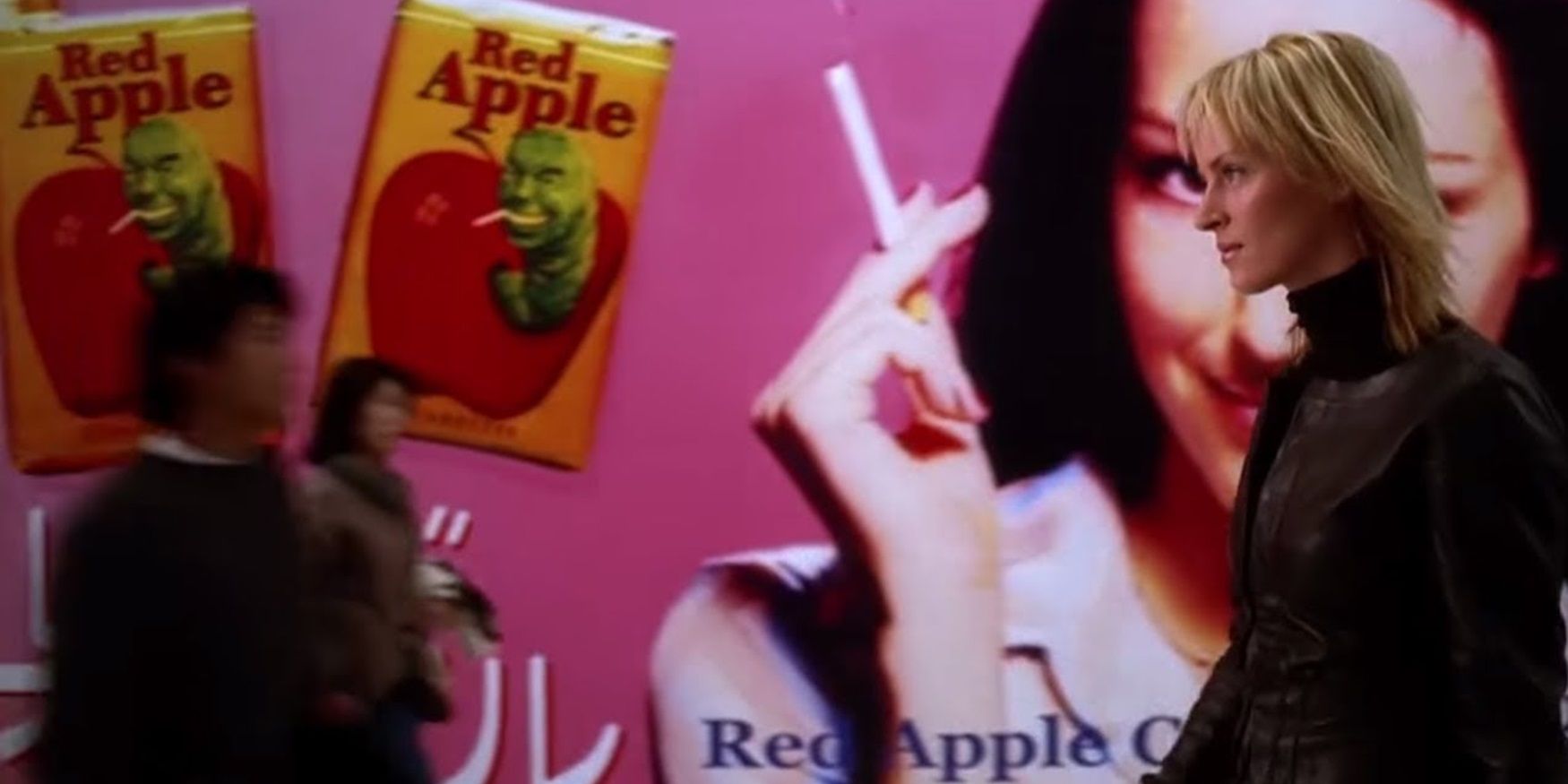 The Bride walks past a Red Apple billboard in Kill Bill Volume 1