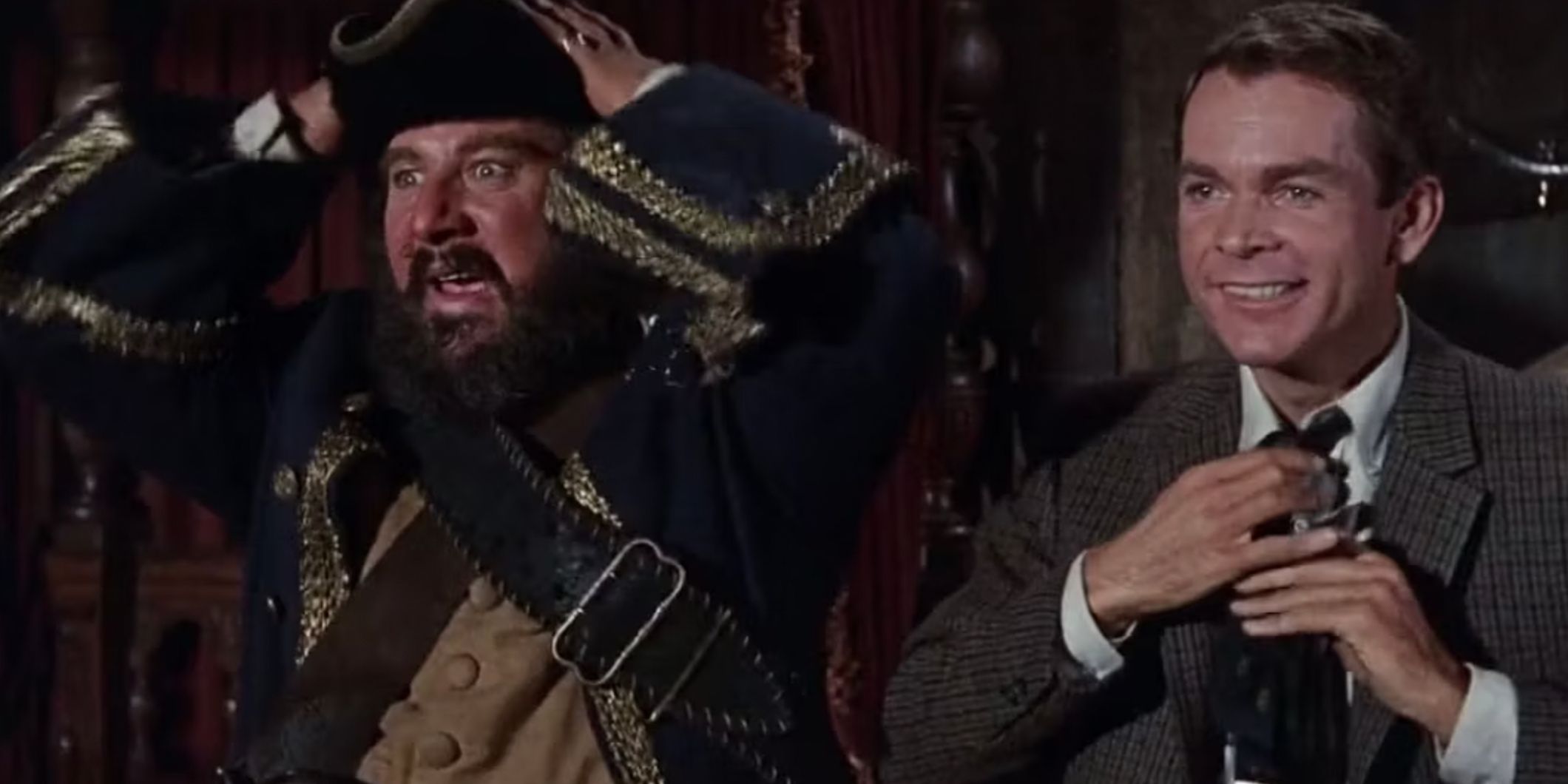 The ghost of Blackbeard next to a man in a suit in 1968 movie Blackbeards Ghost