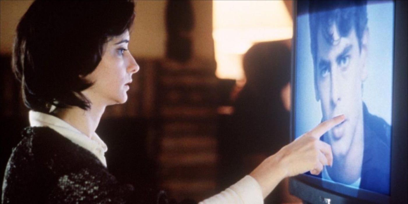 A woman touches a man&rsquo;s face on a TV screen in Thesis