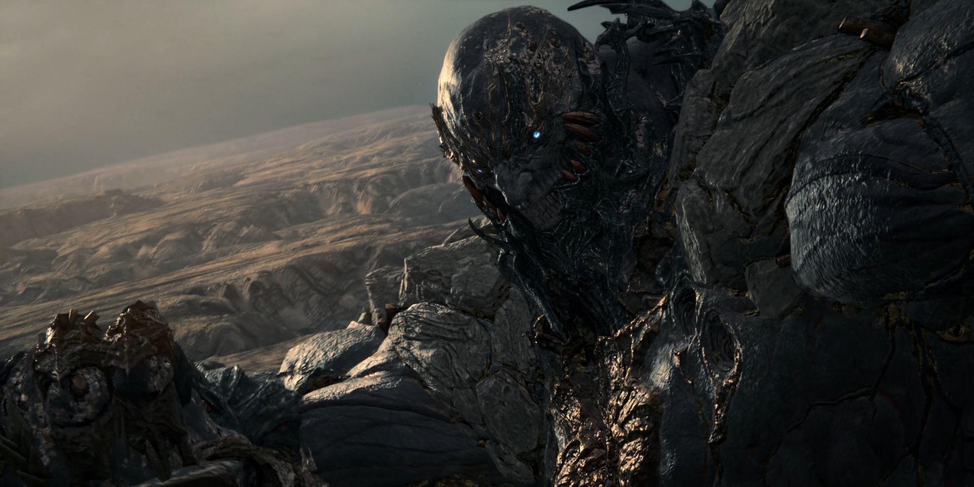 Titan, a giant made of stone, winds up a punch in a screenshot from Final Fantasy 16.