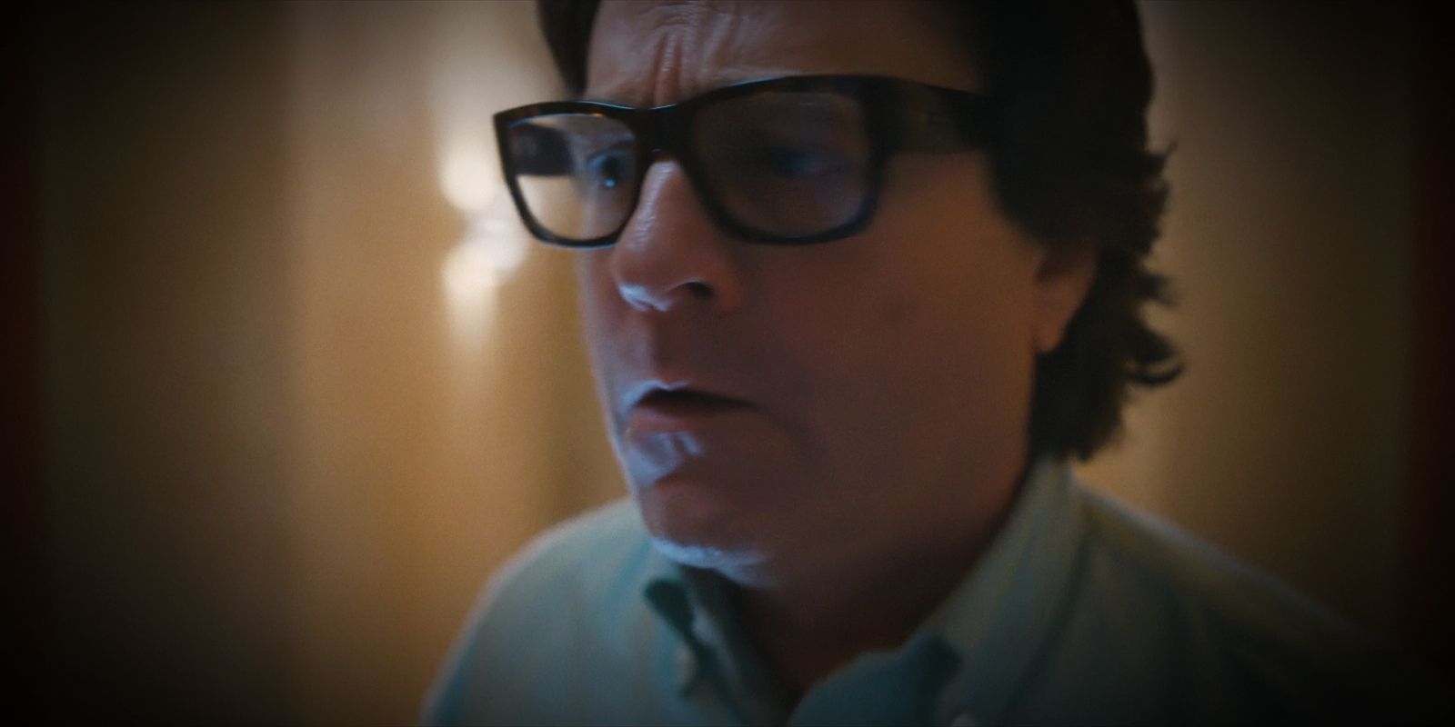 Ty Warner screams at Robbie through the hotel door.
