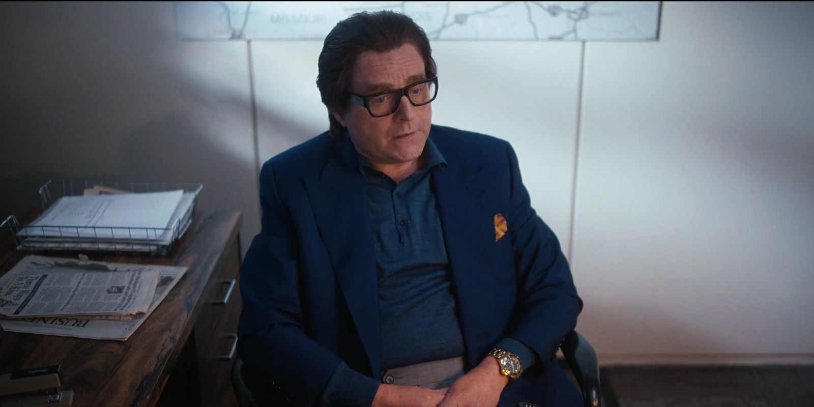Ty Warner sits at his work desk looking defeated.