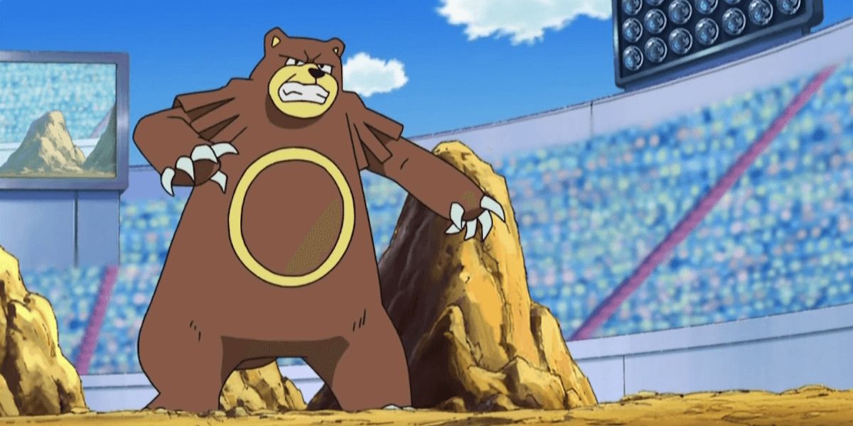 Ursaring from Pokemon standing in an arena type setting with large rocks behind them