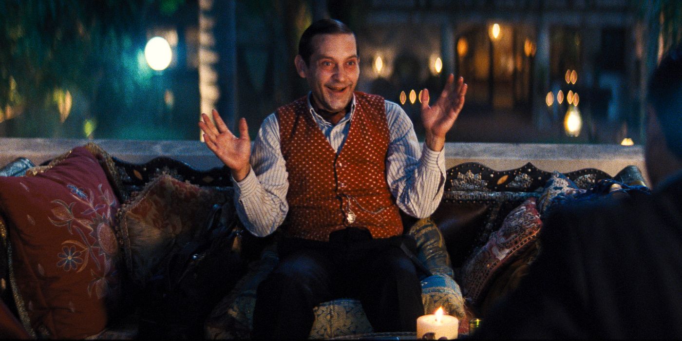 James McKay played by Tobey Maguire sits on a couch in his mansion.