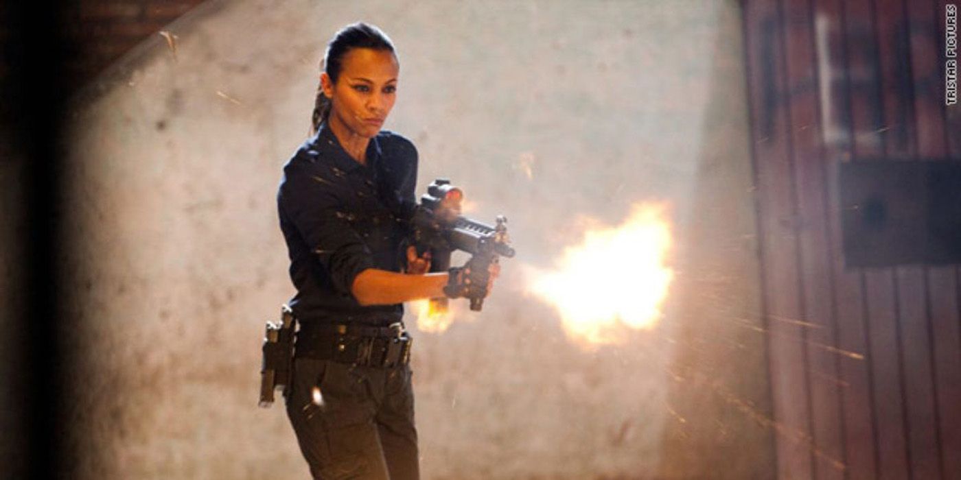 Cataleya Restrepo (Zoe Saldana) in Colombiana firing an assault rifle.