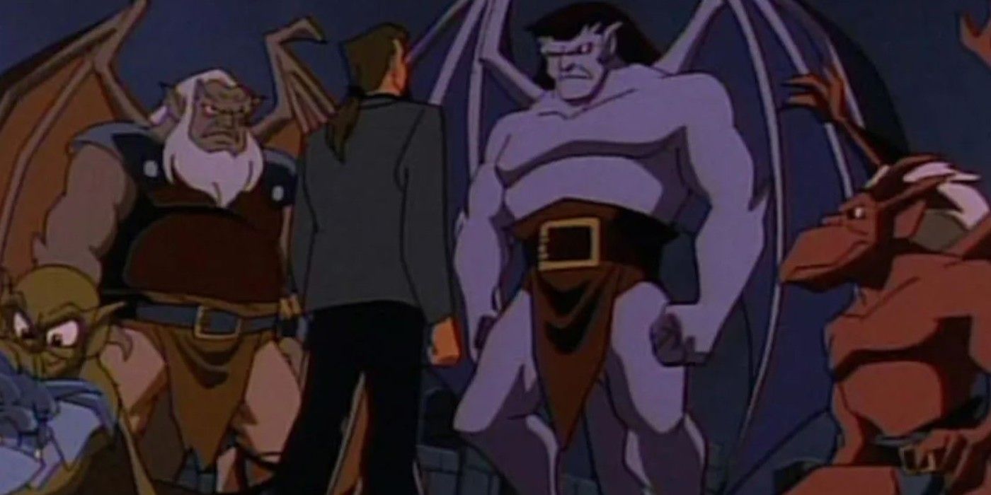 Goliath and two gargoyle companions look down at a human in Gargoyles.