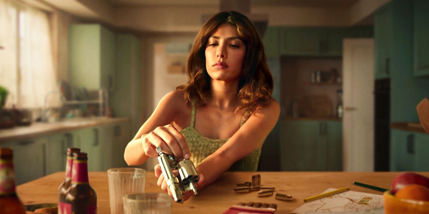 A woman loading a revolver at the table in Who is Erin Carter