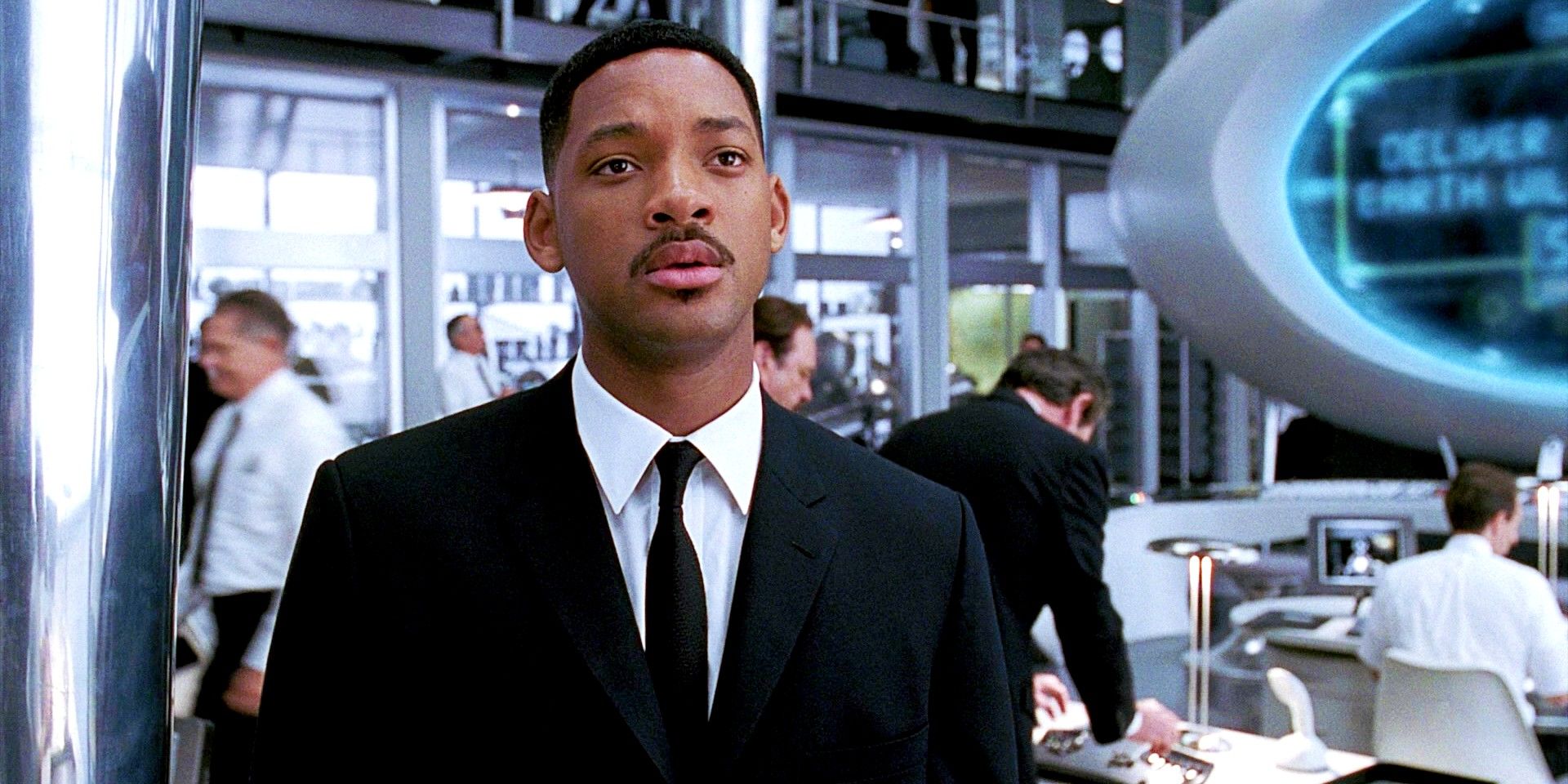Agent J looking at someone at the headquarters in Men in Black