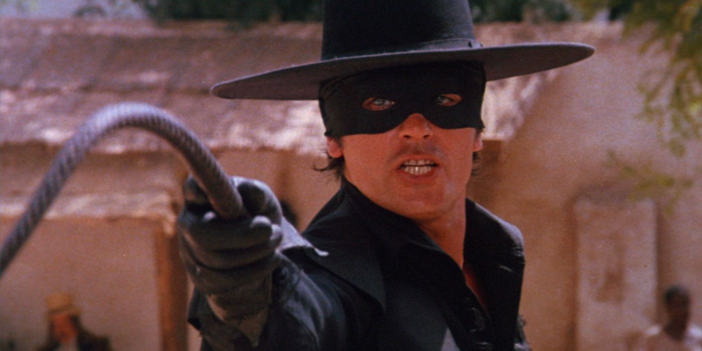 Alain Delon holding a whip as Zorro