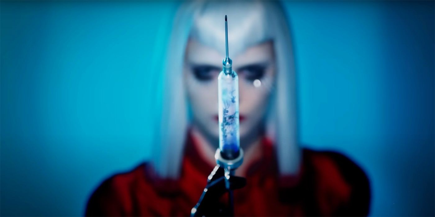 Cara Delevingne blurred and holding a syringe full of spiders in American Horror Story: Delicate teaser 