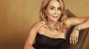 April The Golden Bachelor sitting on a chair in black strapless dress