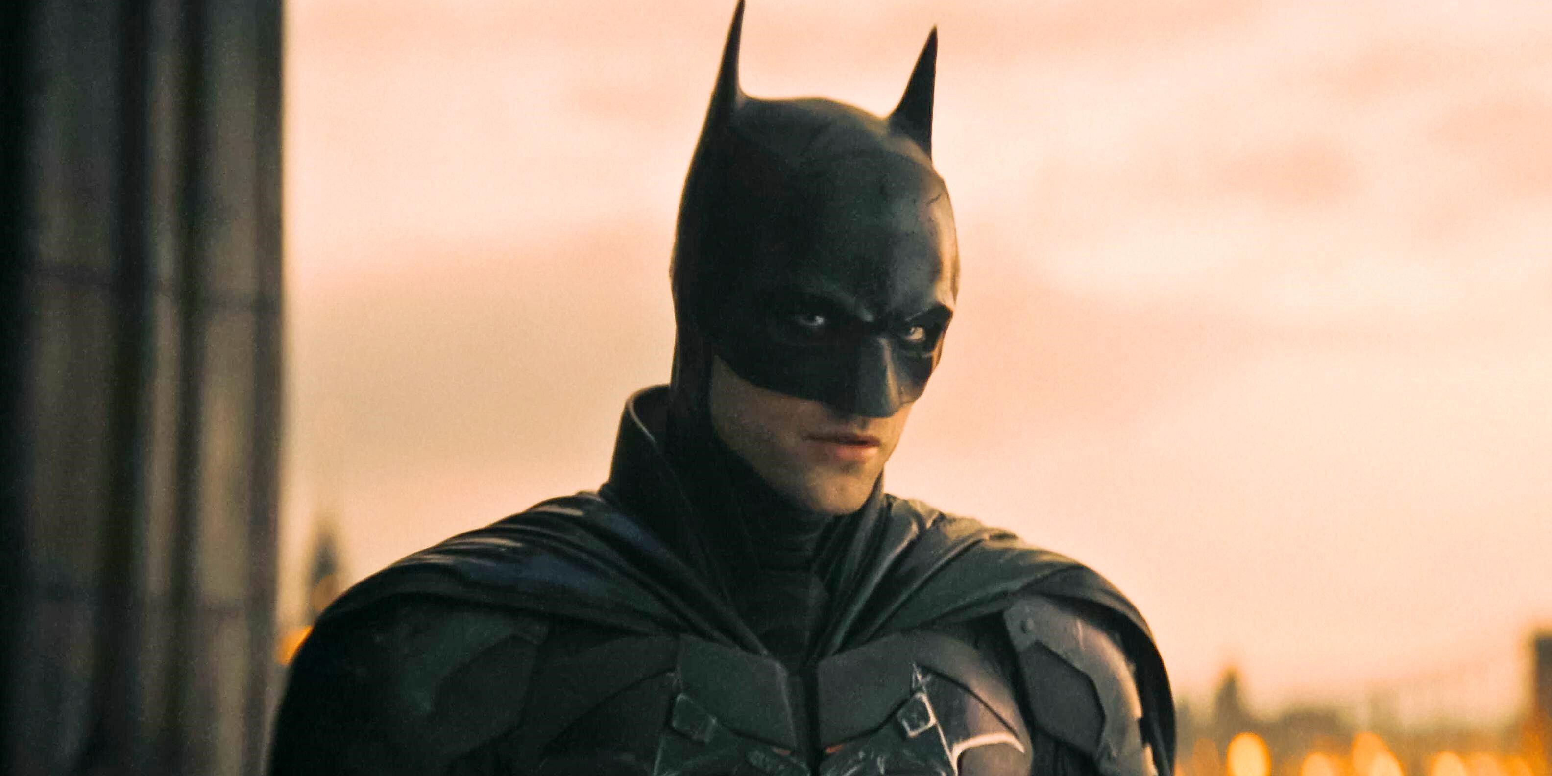 Robert Pattinson's Batman in his costumer and cowl, looking menacing.