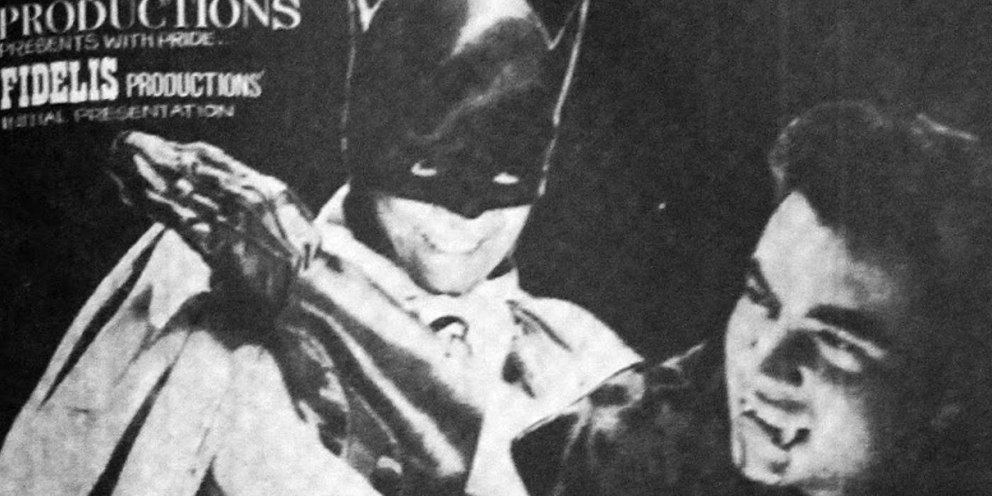 Batman slaps Dracula across the face.