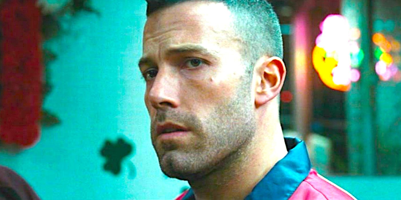 Ben Affleck with stubble and close-cropped hair looking concerned in The Town