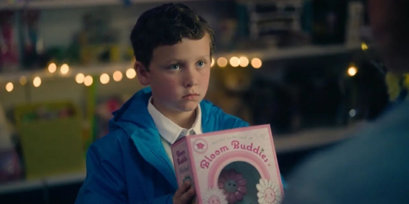 Benjamin Chivers as Isaac Stevens holding a toy in The Devil's Hours.