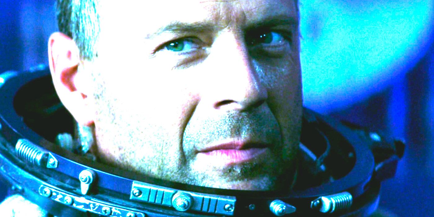 Bruce Willis in an astronaut suit with helmet off, grinning smugly, in Armageddon