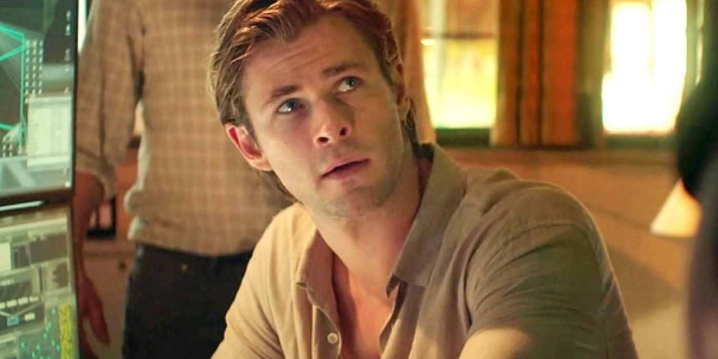 Chris Hemsworth looking up at someone In Blackhat