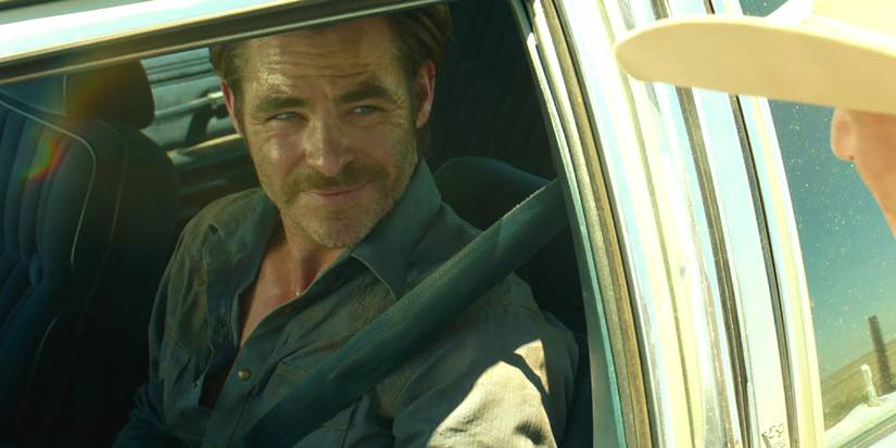 Chris Pine in the drivers seat talking to someone outside in Hell or High Water