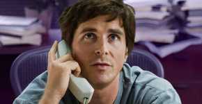 Christian Bale as Michael Burry on the phone, looking up in The Big Short