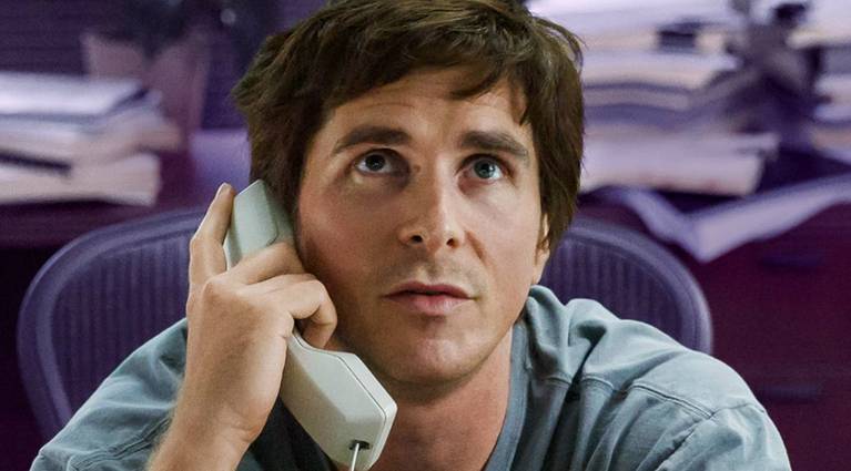 Christian Bale as Michael Burry on the phone, looking up in The Big Short